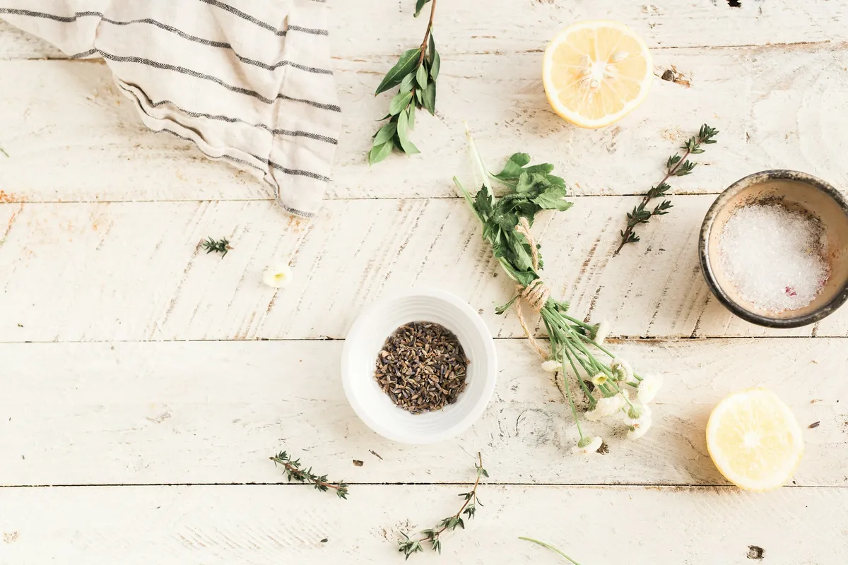 Natural botanical herbs and ingredients arranged on a clean surface
